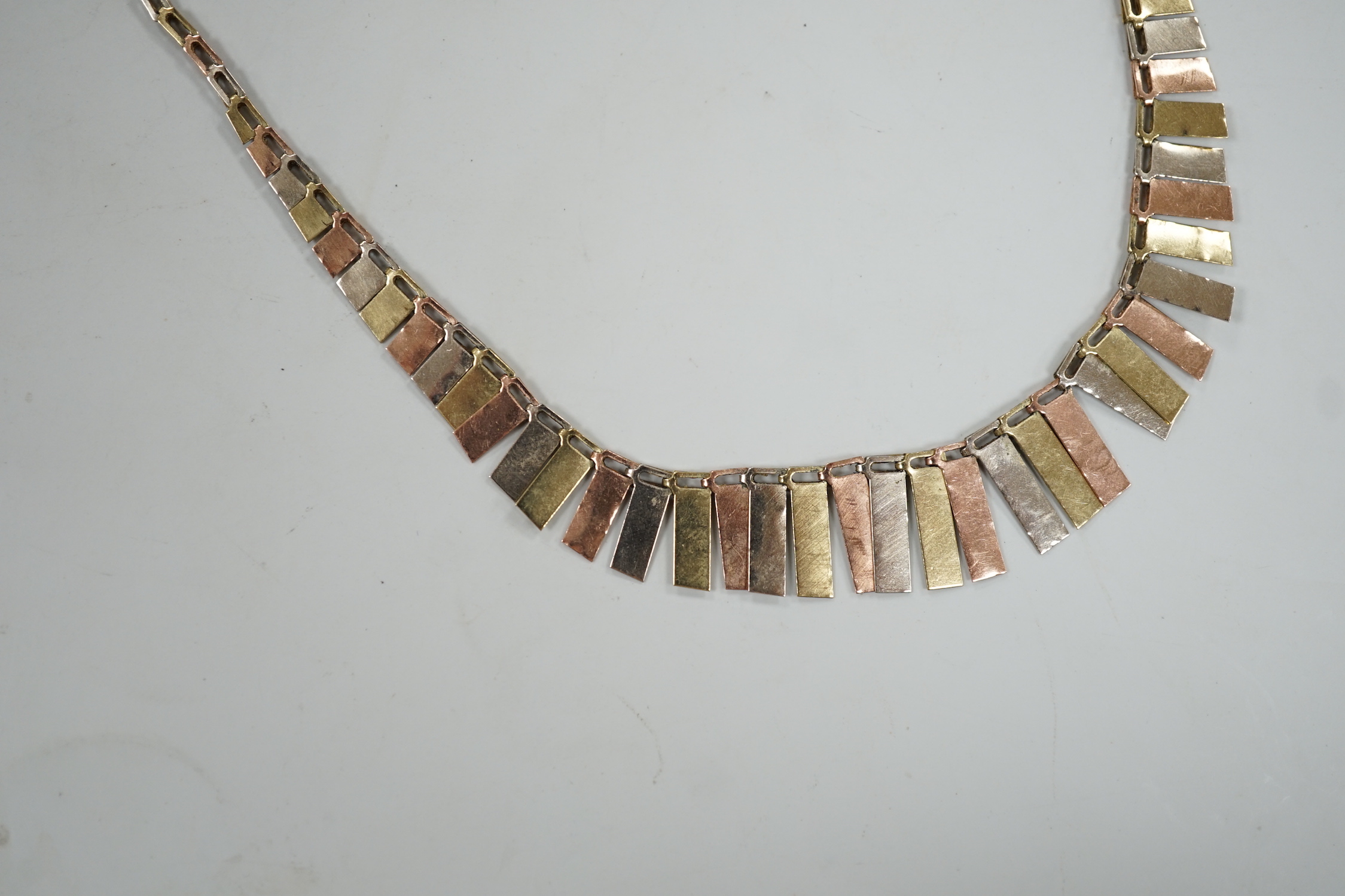 A modern three colour 9ct gold fringe necklace, 40cm